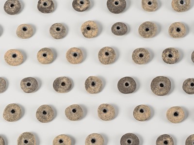 A RARE LOT WITH 59 SILVER FOIL RINGED STONE BEADS, c. 10TH – 12TH CENTURY