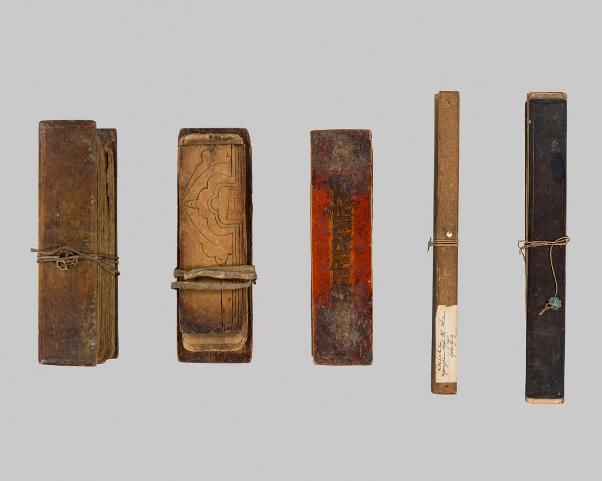 Lot 1487 - A GROUP OF FIVE BUDDHIST PRAYER BOOKS