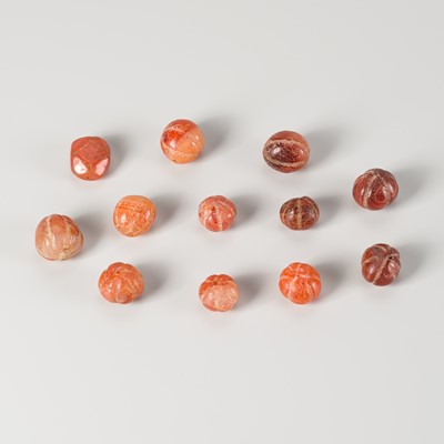 A LOT WITH 12 PYU CARNELIAN AGATE BEADS, 7th – 9th CENTURY