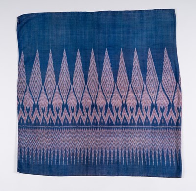 Lot 988 - A KHMER TRIBAL BLUE-GROUND SILK IKAT TEXTILE, 1900s