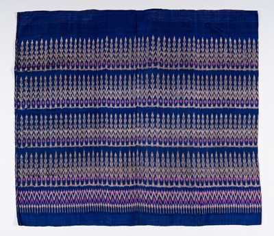 Lot 984 - A KHMER TRIBAL MIDNIGHT BLUE SILK IKAT TEXTILE, 1900s