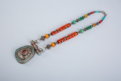 Lot 1064 - A TIBETAN NECKLACE WITH A SILVER PENDANT, c. 1920s