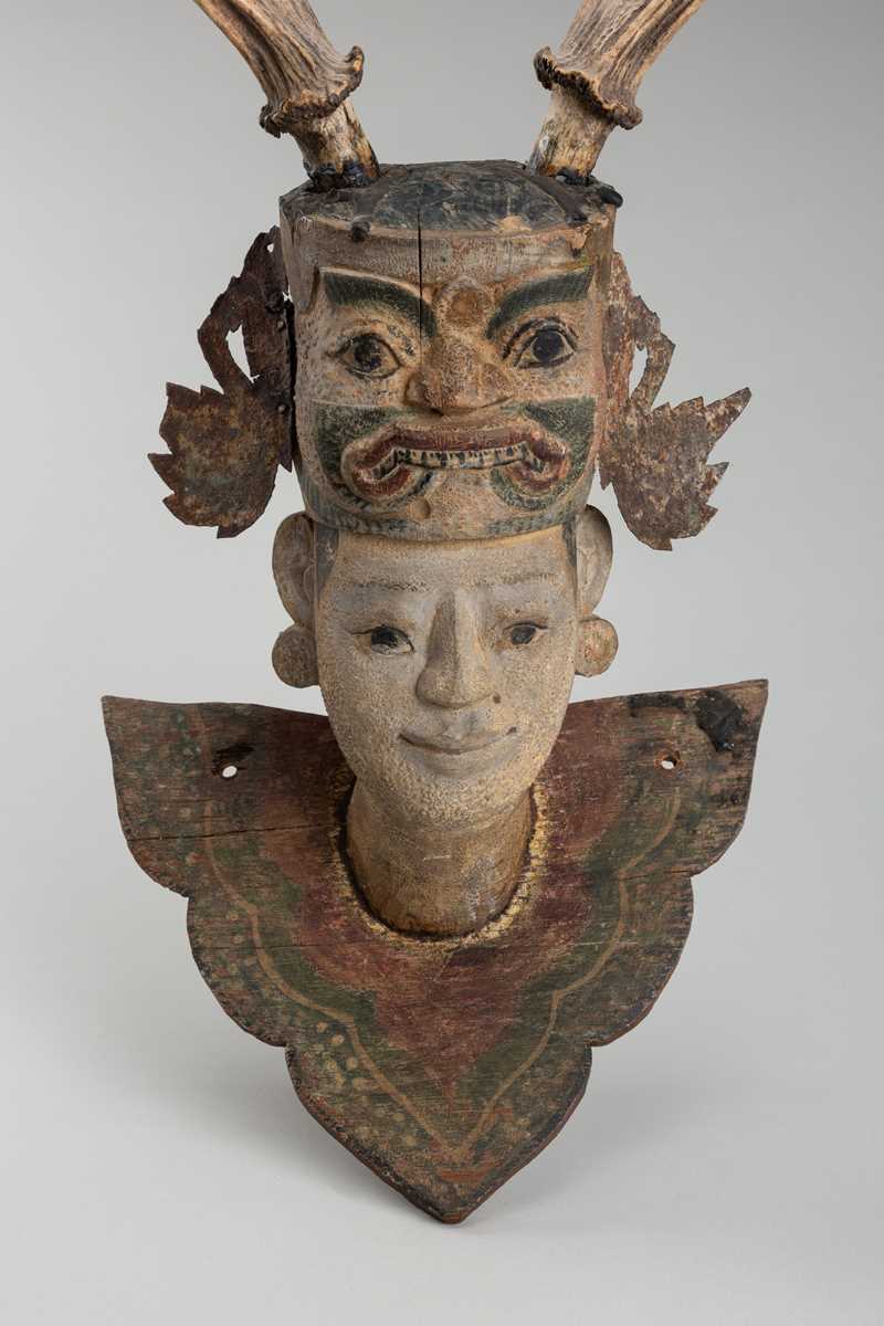 Lot 1518 - A BURMESE WOOD NAT HEAD WITH ANTLER HEADDRESS, 19TH CENTURY