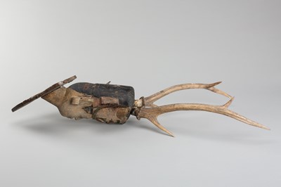 Lot 1518 - A BURMESE WOOD NAT HEAD WITH ANTLER HEADDRESS, 19TH CENTURY