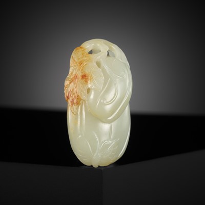 Lot 447 - A PALE CELADON AND RUSSET JADE 'MELON AND BUTTERFLY' CARVING, 18TH CENTURY