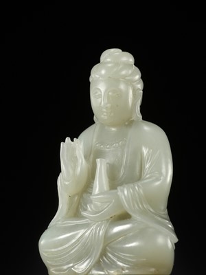 Lot 114 - A SMALL PALE CELADON JADE FIGURE OF GUANYIN, QING DYNASTY