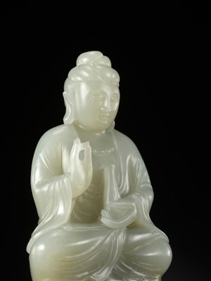 Lot 114 - A SMALL PALE CELADON JADE FIGURE OF GUANYIN, QING DYNASTY