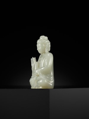 Lot 114 - A SMALL PALE CELADON JADE FIGURE OF GUANYIN, QING DYNASTY