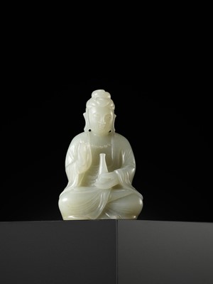 Lot 114 - A SMALL PALE CELADON JADE FIGURE OF GUANYIN, QING DYNASTY