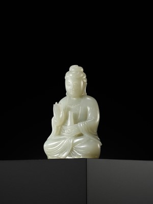 Lot 114 - A SMALL PALE CELADON JADE FIGURE OF GUANYIN, QING DYNASTY