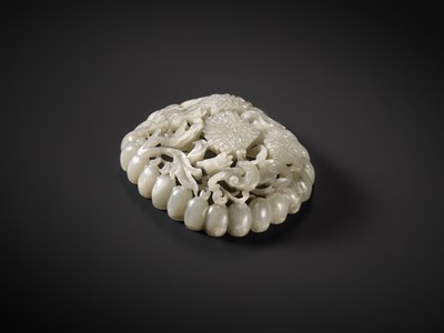 Lot 104 - A RETICULATED PALE CELADON JADE ‘CHRYSANTHEMUM AND BAT’ PLAQUE, JIN TO YUAN DYNASTY