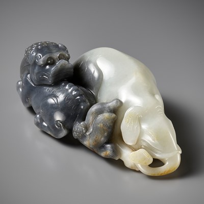 Lot 111 - A LARGE BLACK AND WHITE JADE ‘LION AND ELEPHANT’ CARVING, QING DYNASTY