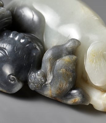 Lot 111 - A LARGE BLACK AND WHITE JADE ‘LION AND ELEPHANT’ CARVING, QING DYNASTY