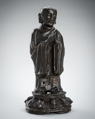 Lot 1550 - A BRONZE FIGURE OF ANANDA, LATE MING DYNASTY