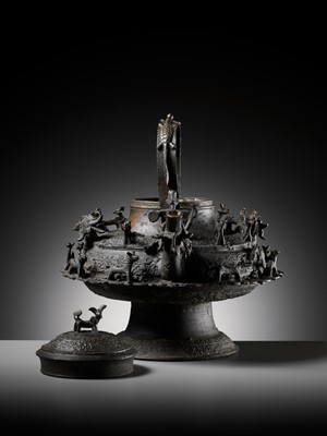 Lot 211 - A MASSIVE BRONZE ‘DRAGON’ KETTLE, CEREK, BORNEO, 19TH CENTURY