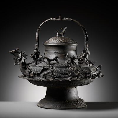 Lot 211 - A MASSIVE BRONZE ‘DRAGON’ KETTLE, CEREK, BORNEO, 19TH CENTURY