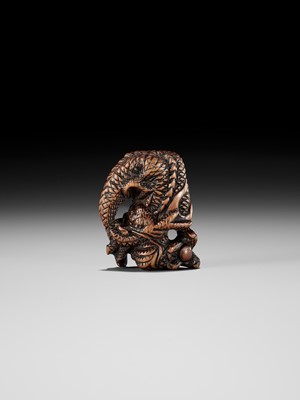 Lot 13 - A POWERFUL WOOD NETSUKE OF A COILED DRAGON