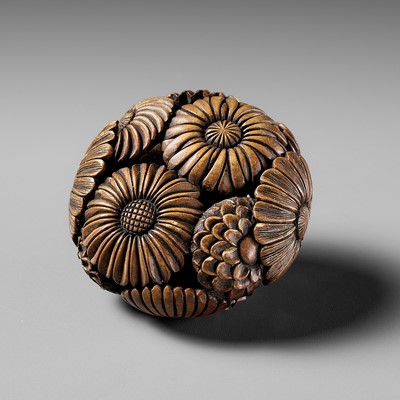 Lot 464 - A FINE WOOD RYUSA MANJU NETSUKE OF KIKU (CHRYSANTHEMUM) BLOSSOMS