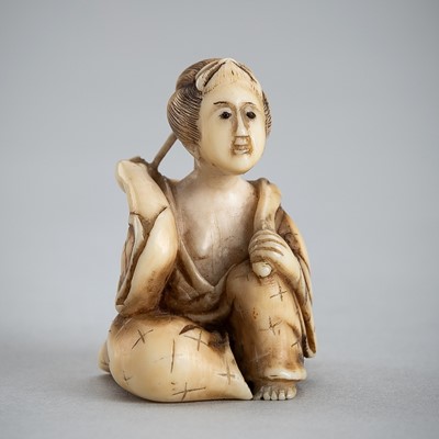 Lot 1414 - RANSEKI: AN IVORY SHUNGA NETSUKE OF A LADY