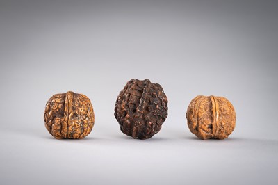 Lot 713 - A GROUP OF THREE WALNUT CARVINGS, c. 19020s
