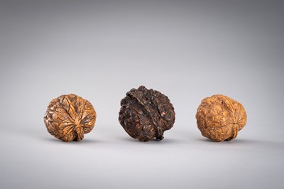 Lot 713 - A GROUP OF THREE WALNUT CARVINGS, c. 19020s