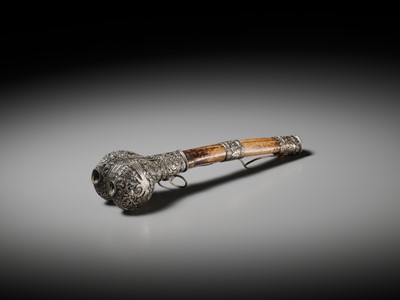 Lot 289 - A CORAL AND TURQUOISE-INLAID SILVER-MOUNTED BONE FLUTE, KANGLING, TIBET, 19TH CENTURY
