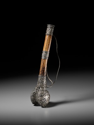 Lot 289 - A CORAL AND TURQUOISE-INLAID SILVER-MOUNTED BONE FLUTE, KANGLING, TIBET, 19TH CENTURY