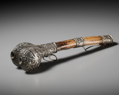 Lot 289 - A CORAL AND TURQUOISE-INLAID SILVER-MOUNTED BONE FLUTE, KANGLING, TIBET, 19TH CENTURY