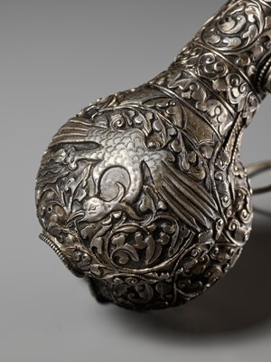 Lot 289 - A CORAL AND TURQUOISE-INLAID SILVER-MOUNTED BONE FLUTE, KANGLING, TIBET, 19TH CENTURY