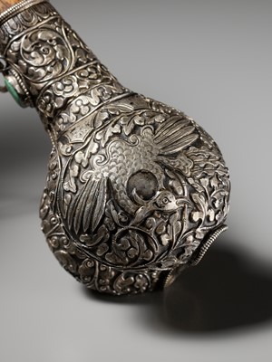 Lot 289 - A CORAL AND TURQUOISE-INLAID SILVER-MOUNTED BONE FLUTE, KANGLING, TIBET, 19TH CENTURY