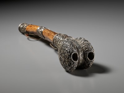 Lot 289 - A CORAL AND TURQUOISE-INLAID SILVER-MOUNTED BONE FLUTE, KANGLING, TIBET, 19TH CENTURY