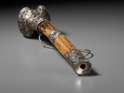 Lot 289 - A CORAL AND TURQUOISE-INLAID SILVER-MOUNTED BONE FLUTE, KANGLING, TIBET, 19TH CENTURY