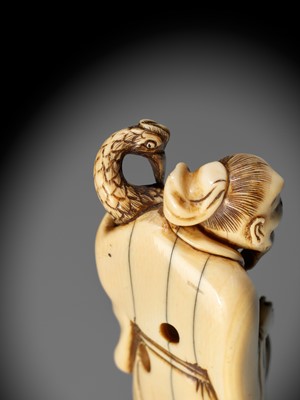 Lot 22 - A VERY RARE AND LARGE IVORY NETSUKE OF BAIFUKU WITH HO-O BIRD