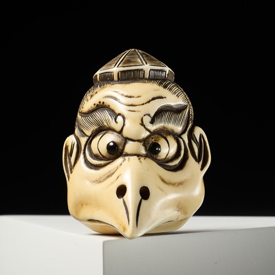 Lot 442 - GARAKU: A FINE IVORY MASK NETSUKE OF A KARASU TENGU