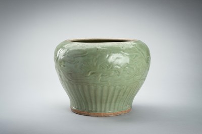 Lot 1856 - A CARVED AND MOLDED LONGQUAN CELADON ‘LOTUS’ PORCELAIN JAR, YUAN TO MING DYNASTY