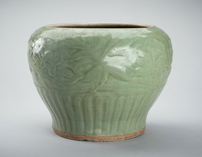 Lot 1856 - A CARVED AND MOLDED LONGQUAN CELADON ‘LOTUS’ PORCELAIN JAR, YUAN TO MING DYNASTY