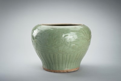 Lot 1856 - A CARVED AND MOLDED LONGQUAN CELADON ‘LOTUS’ PORCELAIN JAR, YUAN TO MING DYNASTY