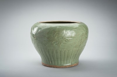 Lot 1856 - A CARVED AND MOLDED LONGQUAN CELADON ‘LOTUS’ PORCELAIN JAR, YUAN TO MING DYNASTY