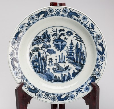 A LARGE BLUE AND WHITE ‘RIVER LANDSCAPE’ PORCELAIN CHARGER, JIAJING STYLE