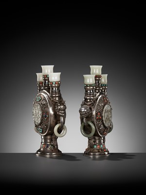 Lot 291 - A PAIR OF MONGOLIAN GEMSTONE-INLAID AND JADE-MOUNTED SILVER CANDLE HOLDERS