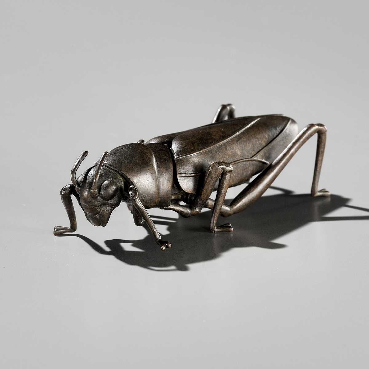 YASUNOSUKE: A BRONZE JIZAI OKIMONO OF A GRASSHOPPER