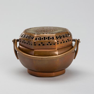 A COPPER-ALLOY HANDWARMER, LATE QING DYNASTY