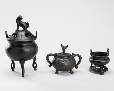 A LOT WITH THREE BRONZE TRIPOD CENSERS