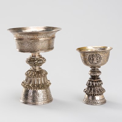 A PAIR OF TIBETAN SILVER BUTTER LAMPS, 19TH CENTURY