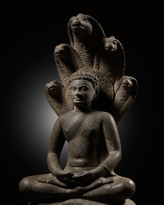 Lot 581 - A SANDSTONE FIGURE OF BUDDHA MUCHALINDA, THAILAND, SUKHOTHAI STYLE, 14TH CENTURY