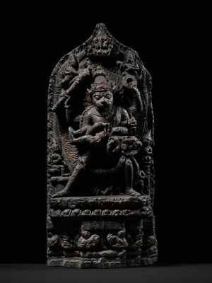 Lot 246 - A RARE BLACK STONE STELE OF NARASIMHA KILLING HIRANYAKASHIPU, PALA PERIOD