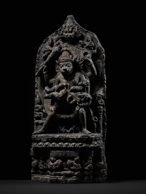 Lot 246 - A RARE BLACK STONE STELE OF NARASIMHA KILLING HIRANYAKASHIPU, PALA PERIOD