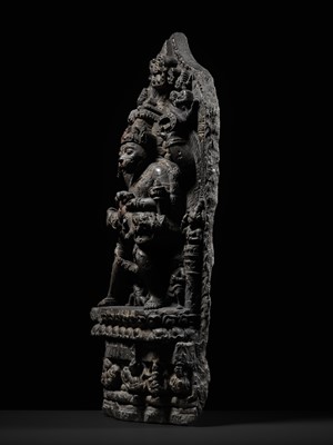 Lot 246 - A RARE BLACK STONE STELE OF NARASIMHA KILLING HIRANYAKASHIPU, PALA PERIOD