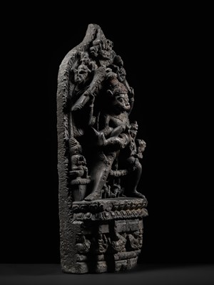 Lot 246 - A RARE BLACK STONE STELE OF NARASIMHA KILLING HIRANYAKASHIPU, PALA PERIOD