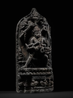 Lot 246 - A RARE BLACK STONE STELE OF NARASIMHA KILLING HIRANYAKASHIPU, PALA PERIOD